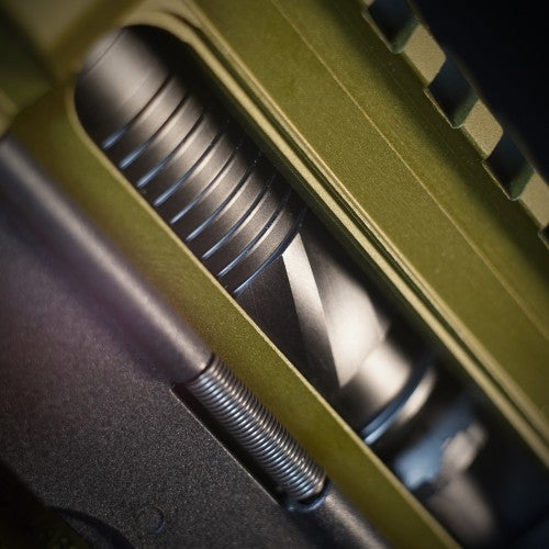 Close-up of a green rifle stock with metal components