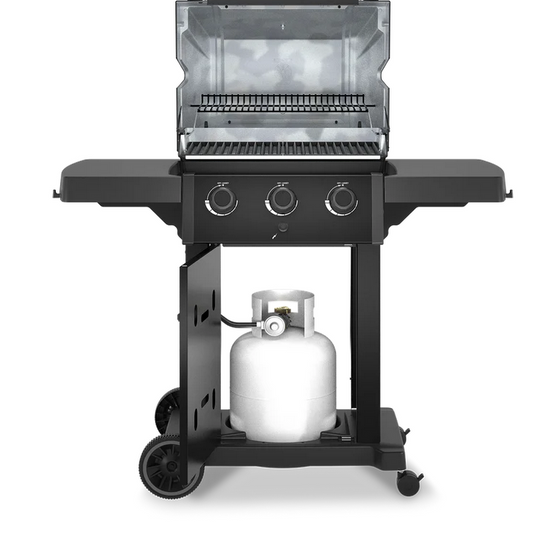 a broil king bbq with the lid and door open